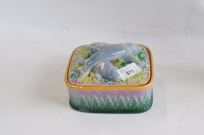 Lot 511 - A French maiolica box and cover, the lid with...