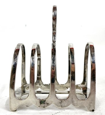 Lot 151 - A George V silver toast rack, four divisions...