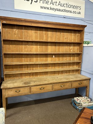 Lot 595 - A late 19th or early 20th Century pine dresser...