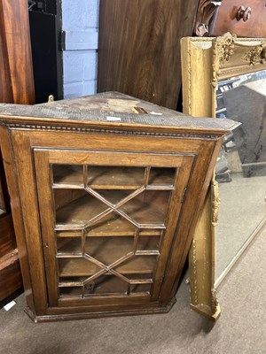 Lot 607 - A 19th Century oak corner cabinet with single...