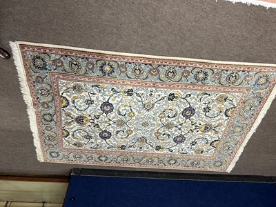 Lot 623 - A 20th Century Middle Eastern wool floor rug...