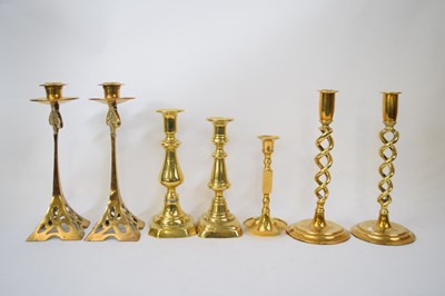 Lot 156 - Collection of brass candlesticks, one pair in...