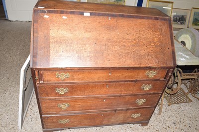 Lot 314 - Georgian oak and mahogany cross banded bureau...