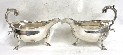 Lot 63 - A pair of George III silver sauce boats of...