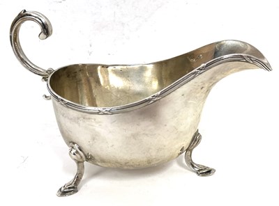 Lot 5 - A George V silver sauce boat of typical form,...