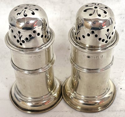 Lot 24 - A pair of Victorian silver peppers of...