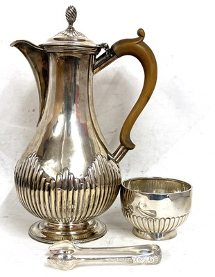 Lot 62 - A Victorian silver hot water jug of baluster...