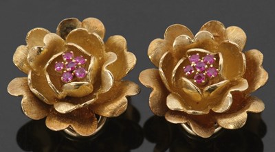 Lot 402 - A pair of gemset floral earclips, the stylised...
