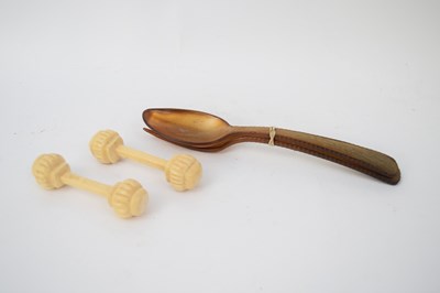 Lot 181 - Two vintage wooden spoons and knife rests