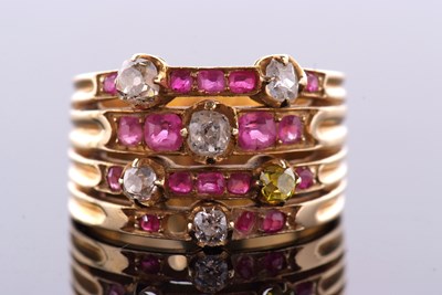 Lot 394 - A diamond and ruby ring, the four bands set...