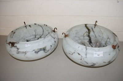 Lot 12 - A pair of circular marbled glass light shades