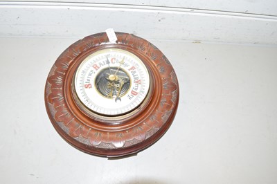 Lot 63 - Late 19th Century aneroid barometer in carved...