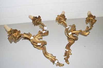 Lot 149 - A pair of brass foliate formed twin light wall...