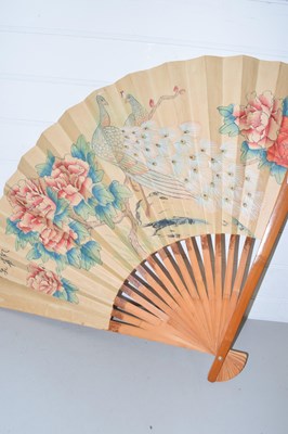 Lot 178 - Large Chinese fan decorated with two peacocks