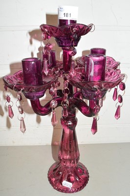 Lot 181 - A modern purple glass candleabra