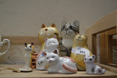 Lot 653 - Seven models of cats