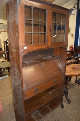 Lot 346 - Arts & Crafts oak combination bookcase and...