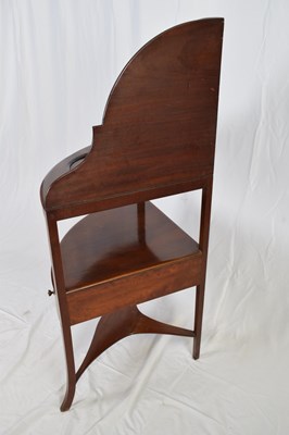 Lot 247 - Georgian mahogany corner washstand with arched...