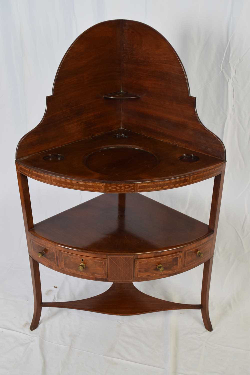 Lot 247 - Georgian mahogany corner washstand with arched...