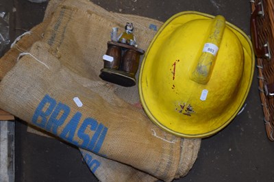 Lot 803 - Yellow firemans helmet together with hessian...