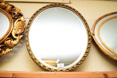 Lot 331 - 20TH CENTURY OVAL BEVELLED WALL MIRROR IN GILT...
