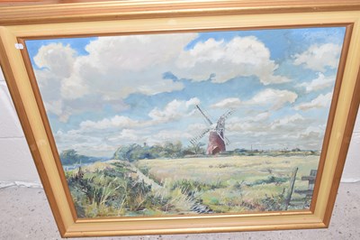 Lot 259 - View of a windmill with cloudy sky, oil on...