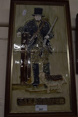 Lot 287 - Tiled plaque of The Gamekeeper, framed