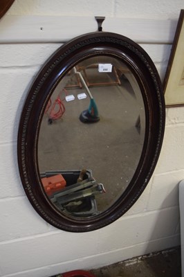 Lot 890 - Edwardian oval bevelled wall mirror in...