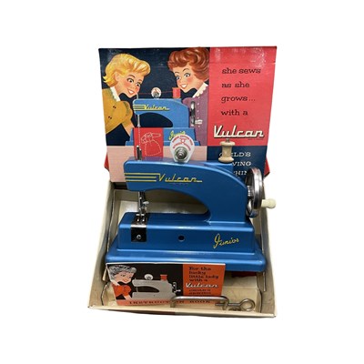 Lot 196 - A boxed child's Vulcan sewing machine in blue.