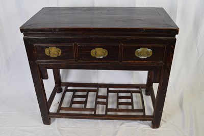 Lot 312 - 20th century Chinese dark elm three drawer...