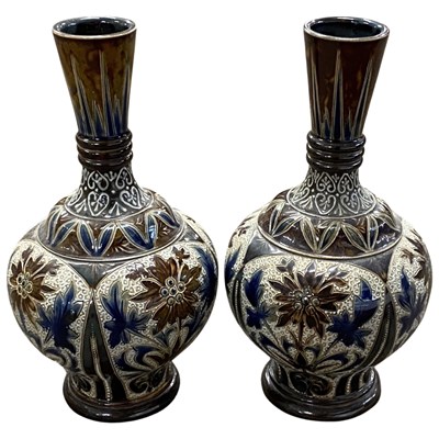 Lot 352 - A pair of Doulton vases with incised floral...