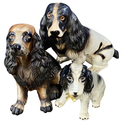 Lot 375 - Three ceramic models of dogs, Spaniels and...