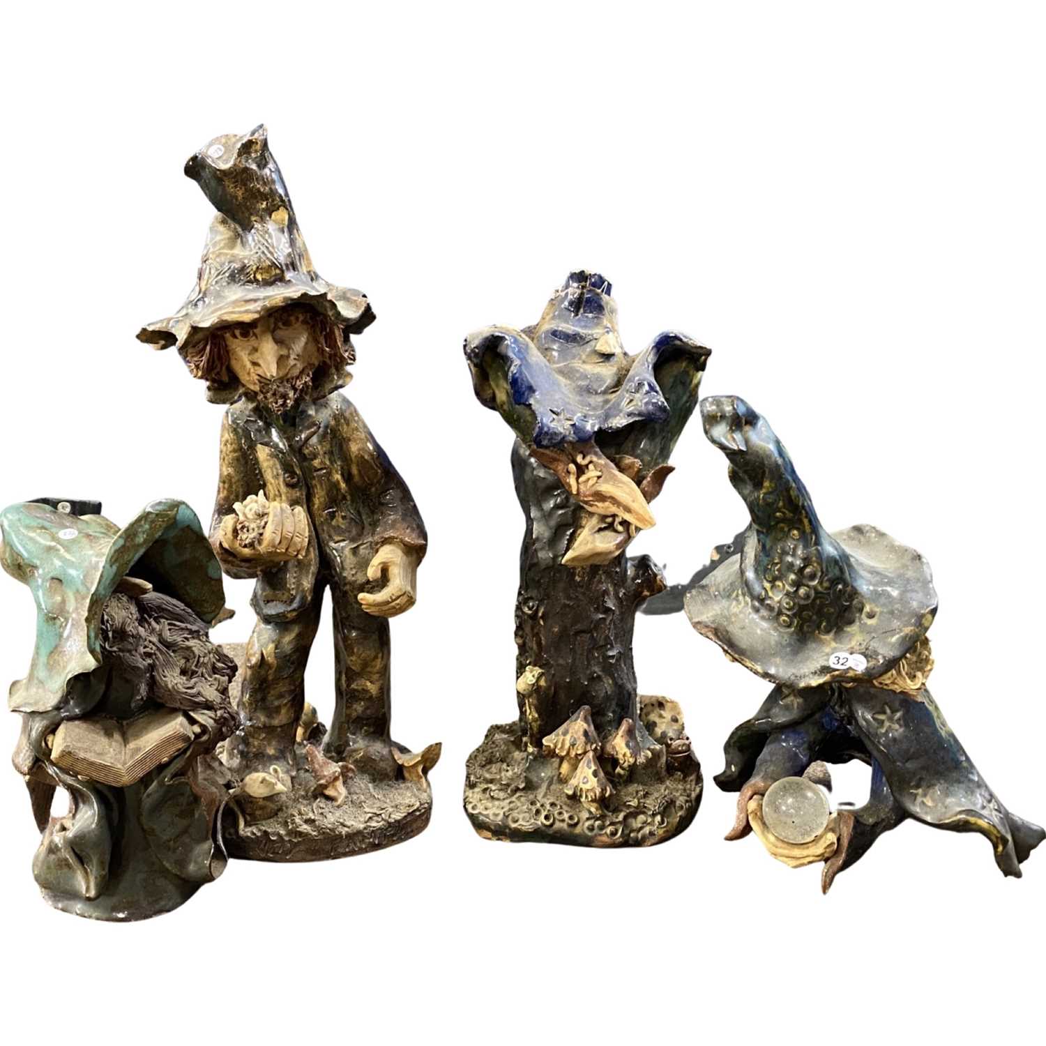 Lot 377 - Group of pottery models of gnomes, largest...