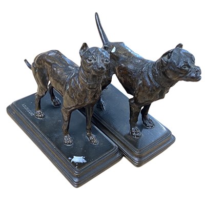 Lot 430 - Two bronze models of dogs on rectangular bases,...