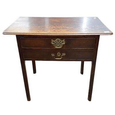 Lot 525 - Georgian oak two drawer low boy fitted with...