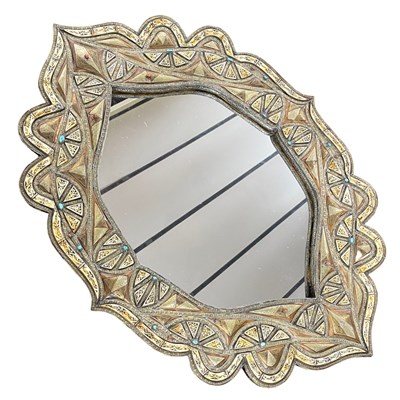 Lot 595 - A North African wall mirror set in a foliate...