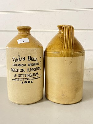 Lot 4 - Two stone ware flagons, one marked Dakin Bros