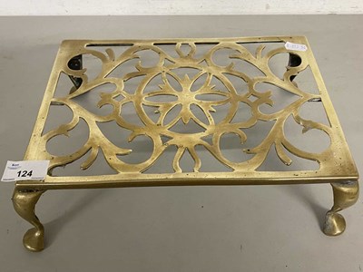 Lot 6 - Brass four footed trivet