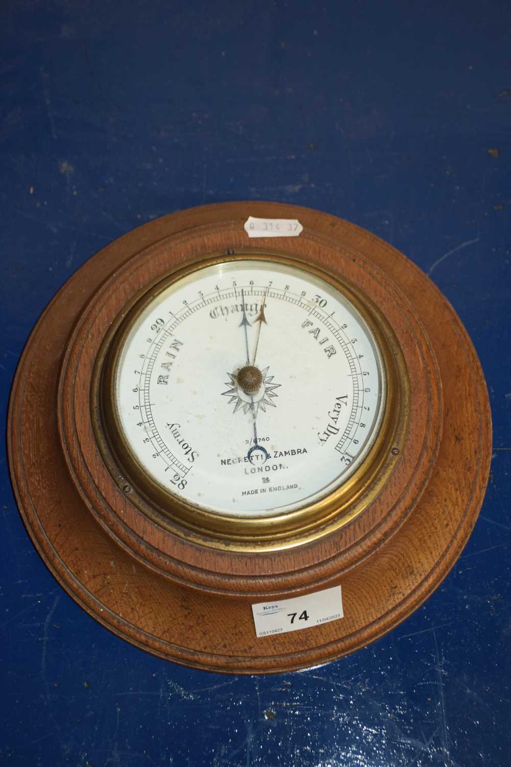 Lot 74 - Oak cased barometer by Negretti & Zambra, London