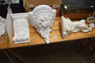 Lot 199 - Three modern composition wall brackets of...