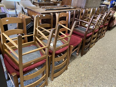 Lot 334 - Thirteen ladder back dining chairs with red...