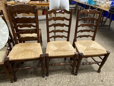 Lot 341 - Three rush seated ladder back dining chairs