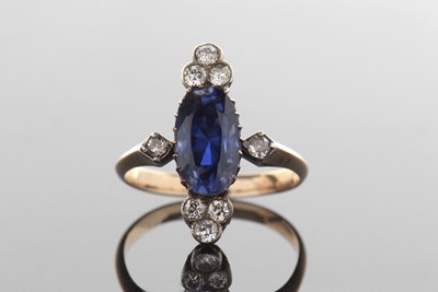 Lot 385 - A sapphire and diamond ring, the oval mixed...