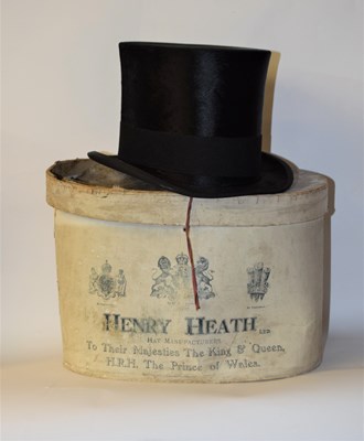 Lot 147 - A black silk top hat by Henry Heath Ltd.,...