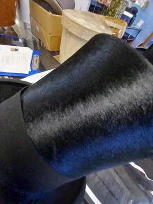 Lot 147 - A black silk top hat by Henry Heath Ltd.,...