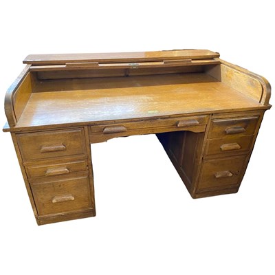 Lot 523 - Early 20th Century oak roll top desk with twin...