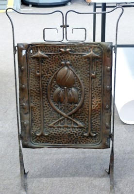 Lot 532 - An Arts & Crafts style iron framed fire screen...