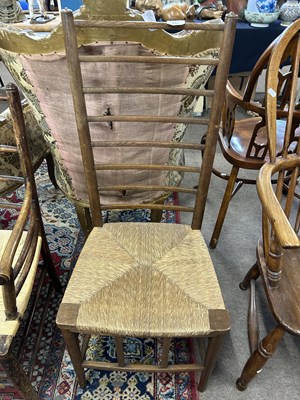 Lot 655 - An Arts & Crafts style rush seat ladder back...