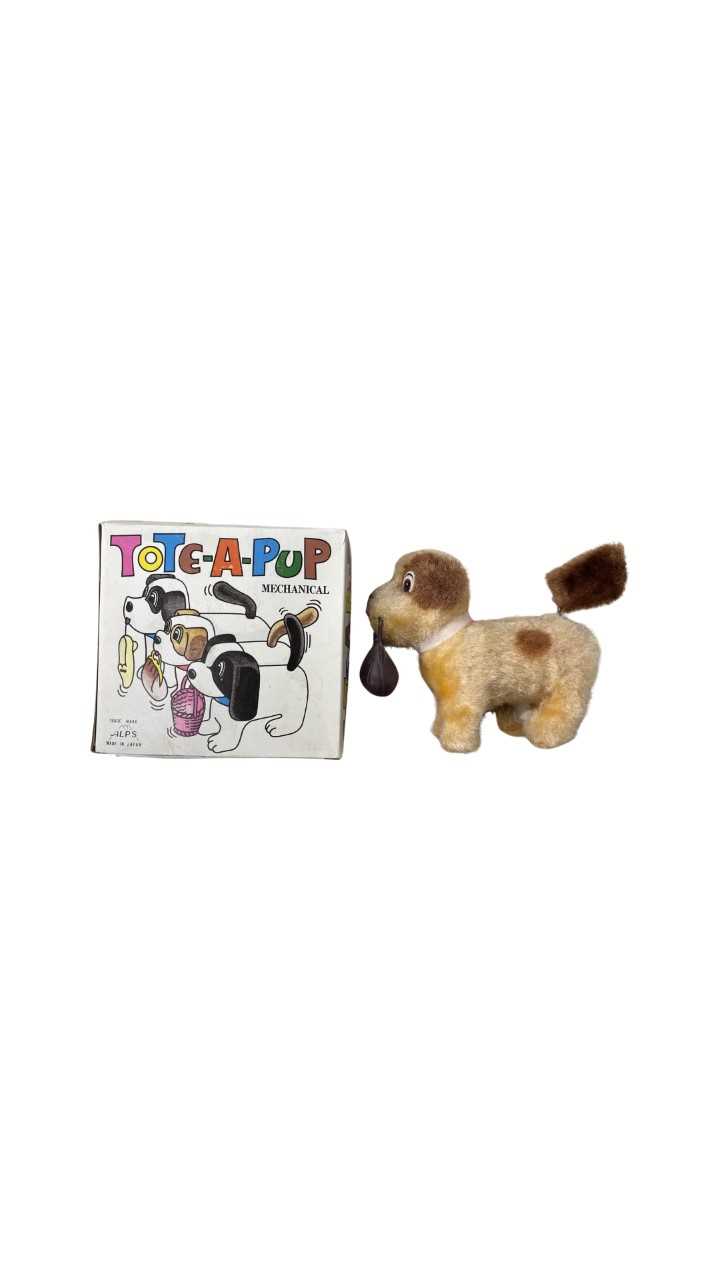 Lot 179 - A boxed Tote-A-Pup mechanical dog toy, by Alps...