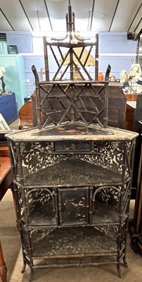 Lot 561 - A 19th Century Chinese bamboo corner cabinet...